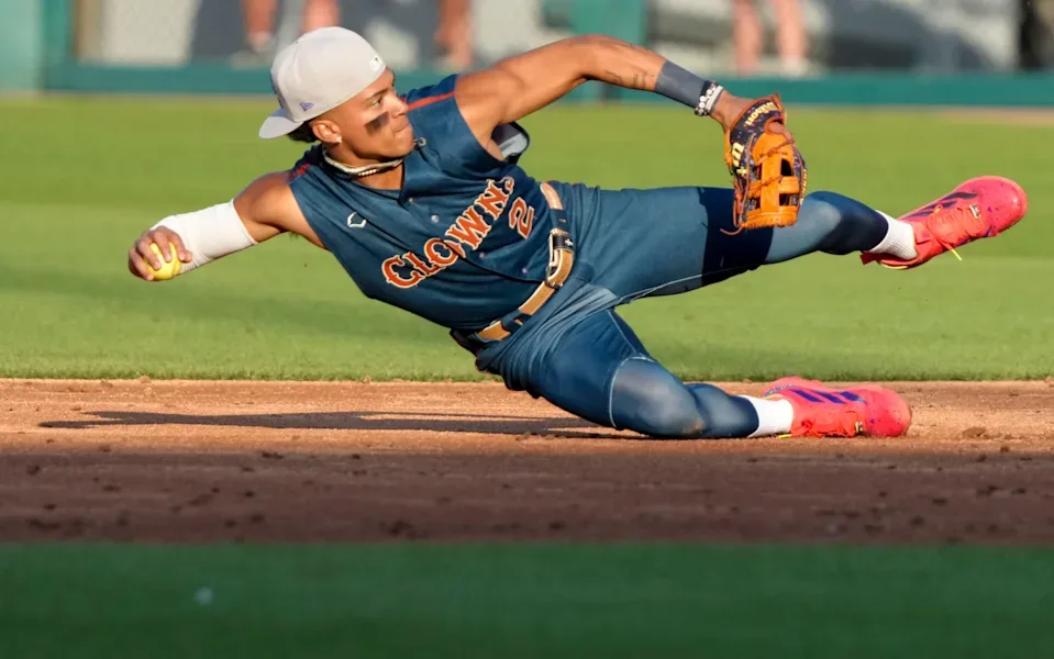 Indianapolis Clowns infielder making a throw during a 2026 Banana Ball game at Victory Field