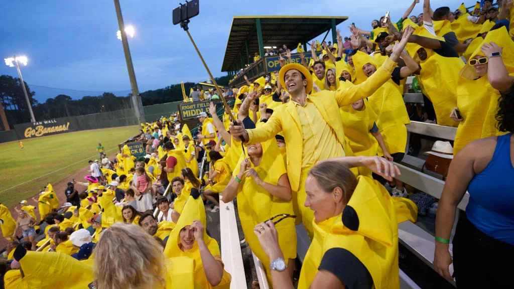 Savannah Bananas players and fans during a Banana Ball game